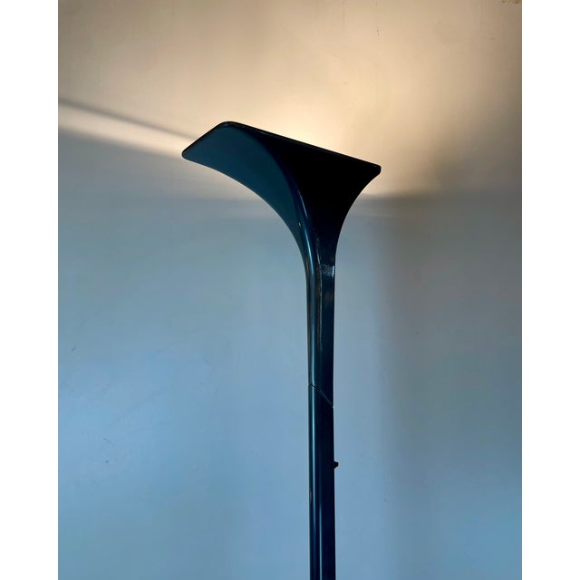 A minimalist, thin, and tall uplighter floor lamp made in grey lacquered aluminum in a mix of textures. Named solaris,...