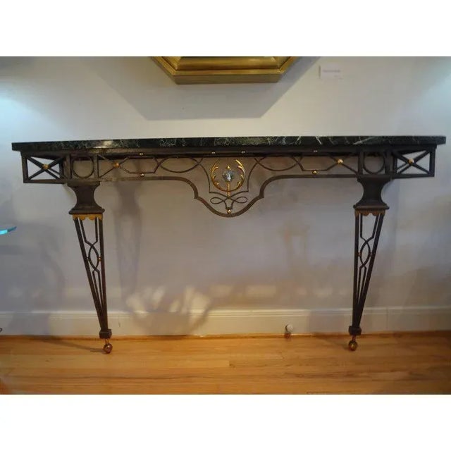Outstanding French Neoclassical style wrought iron console table attributed to Gilbert Poillerat, 1940s. This stunning...