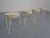 Set of 4 hairpin stools from the 1960s. The legs are made of white painted metal and were probably repainted before. Seats...