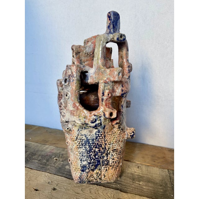 This unique ceramic sculpture is one of a kind. It has wonderful color, detail as well as overall aesthetic. It stands 14"...