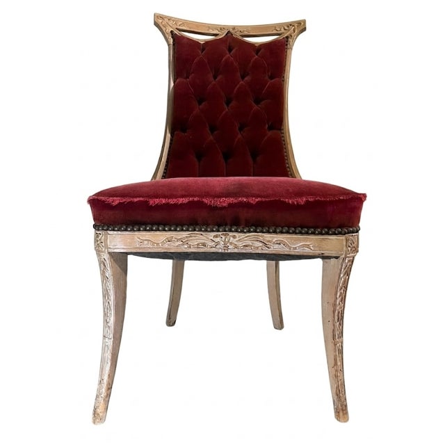 Pair of early 20th-century French Regency slipper chairs featuring a distinctive hand-carved frame with a rare double-...