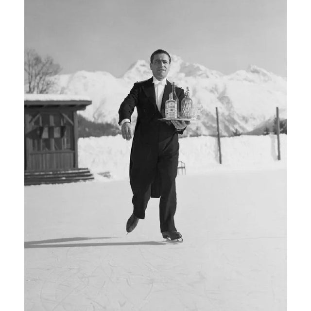 "Skating Waiter" by Horace Abrahams 8th January 1938: A waiter skates across the ice at St. Moritz carrying a tray of...