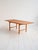 1960s table with teak top and oak frame, featuring a pull-out extension. Extendable dining table from the 1960s, featuring...