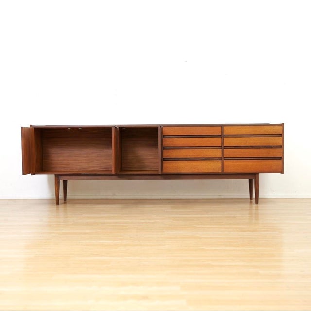 An exceptional mid century modern sideboard designed by Ward & Austin in the 1960s, featuring a striking linear...