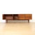 An exceptional mid century modern sideboard designed by Ward & Austin in the 1960s, featuring a striking linear...