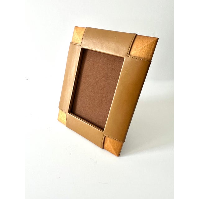 A wonderful picture frame in the style of Ralph Lauren. The frame is fabricated with mitered Wood and Leather on each...