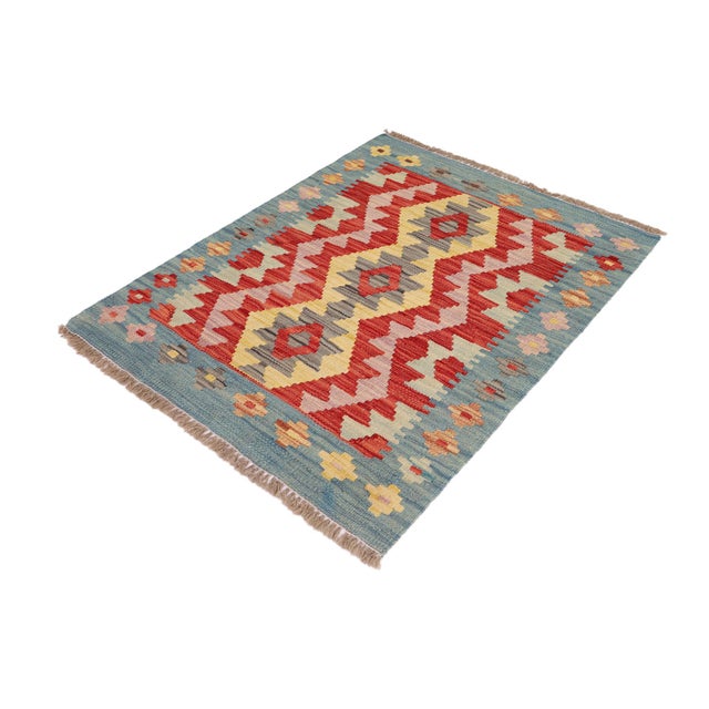 Elevate the elegance of your home with this stunning hand-woven tribal Kilim wool rug. Meticulously crafted on a loom by...