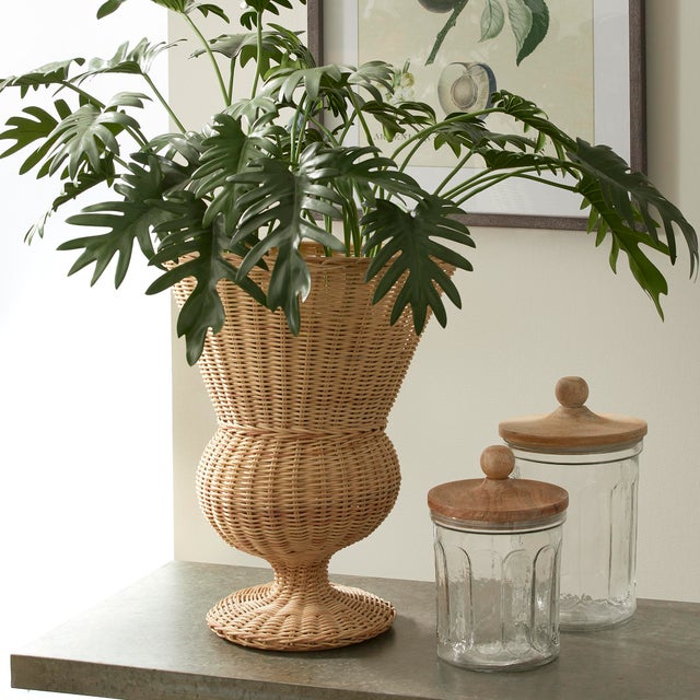 Woven in the form of a classical ceramic urn, this statuesque wicker vessel is an unexpected look. Display just as it is,...