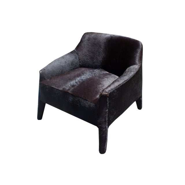 A "Murphy" black hair on hide armchair by Verellen. This piece has an all-over black fur design. The underside is marked...