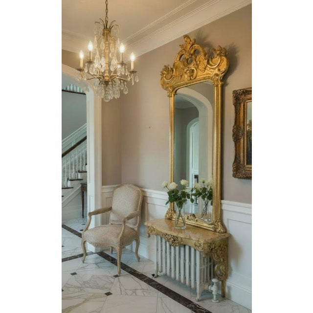 An exceptional and imposing&nbsp;19th-century Rococo Revival pier mirror with its matching console, distinguished by...