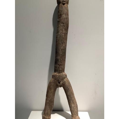 Burkina Faso - Bangala Statue, 20th century Hardwood, crusty patina of use Dimensions: 88 x 26 cm A great classic of the...