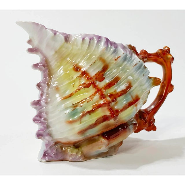 Antique Royal Bayreuth spikey shell creamer pitchers with vibrant colors of pink, green, brown, and orange. Shape and...