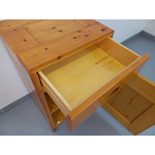 Vintage jam-type storage unit from the 60s and 70s, in pine, by Charlotte Perriand for Les Arcs, a sliding drawer and a...