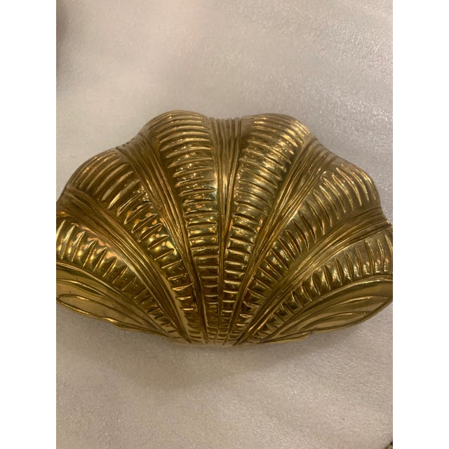 A circa 1940's gilt bronze shell sconces with interior lights