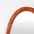 Oval mirror with a walnut frame dating from the 1940s. It features a simple classic design suitable for a hallway, living...