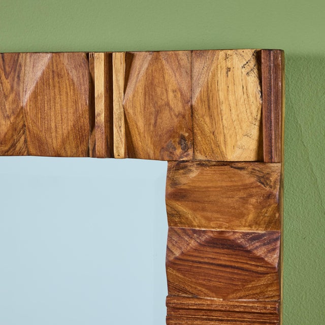 Rectangular wall mirror features a carved walnut frame with varying geometric design. Ready to be hung both vertically or...
