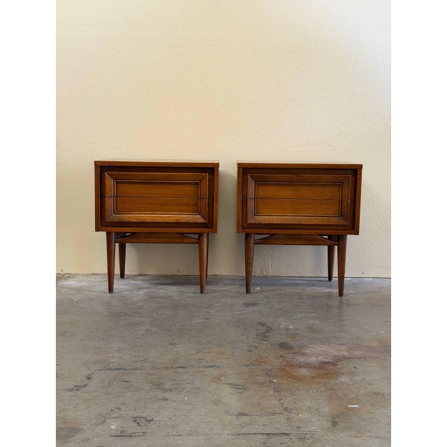 Pair of authentic Mid Century Modern walnut nightstands by Basic Witz Furniture, Waynesboro, Virginia. These striking...