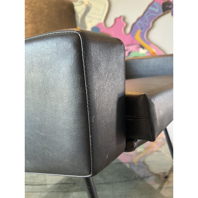 Troika armchair of French designer Pierre Guariche for Airborne 1950; The modernist chair recognizes itself by its elegant...