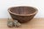 There is something deeply grounding about holding a vessel that was hewn by hand from a single block of wood. This antique...