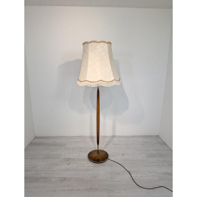 Danish Teak and Brass Floor Lamp from the 1960s/1970s Stylish Danish teak and brass floor lamp from the 1960s or 1970s....