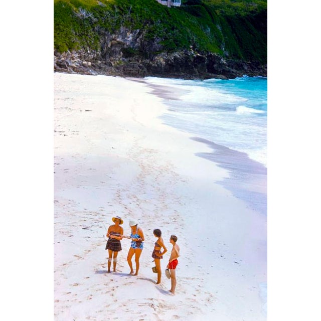 Beachgoers In Bermuda by Toni Frissell Beachgoers stroll on the beach in Bermuda, 1960. (Photo by Toni Frissell) 16x12"...