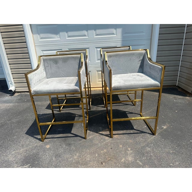 These Erin Gold Counter Stools offers a sophisticated fusion of modern glam and timeless design, highly coveted by top...