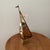 The Mid-Century Modern Brass & Copper Sailboat Sculpture on the Stone Base by Curtis Jere is a unique piece of art that...
