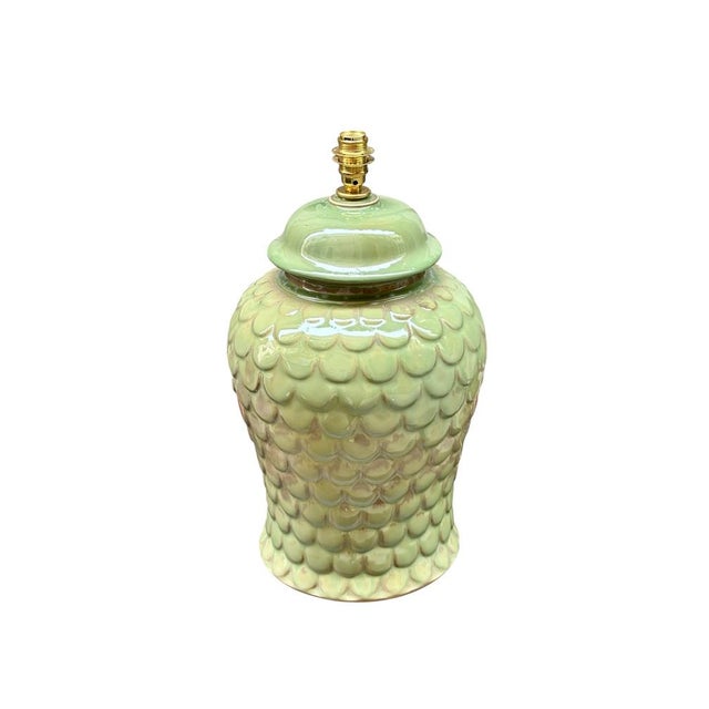 Italian glazed ceramic lamp, circa 1960, with a relief design of overlapping scales and an apple green finish with...