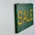 A beautiful aged SALE sign on wood with bright green and yellow. Its simplicity is its beauty. Two original hooks still...