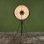 Mariano Fortuny Photographer floor lamp, c.1980s, Italy. The floor lamp is constructed of a black steel tripod frame with...