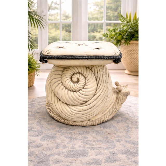 A wonderfully whimsical vintage Italian terracotta snail garden stool featuring sculptural shell detailing and a tufted...