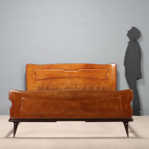 Double bed in exotic wood veneer. Good condition. This piece is attributed to the mentioned designer/maker. It has no...