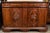 Stately, two-over-two, 1850s, hand carved, rounded edge, solid walnut buffet on a raised, stepped base of the same. The...