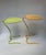 Pair of vintage wrought iron lily pad tables attributed to John Salterini. Each has a leaf-form metal top with scalloped...