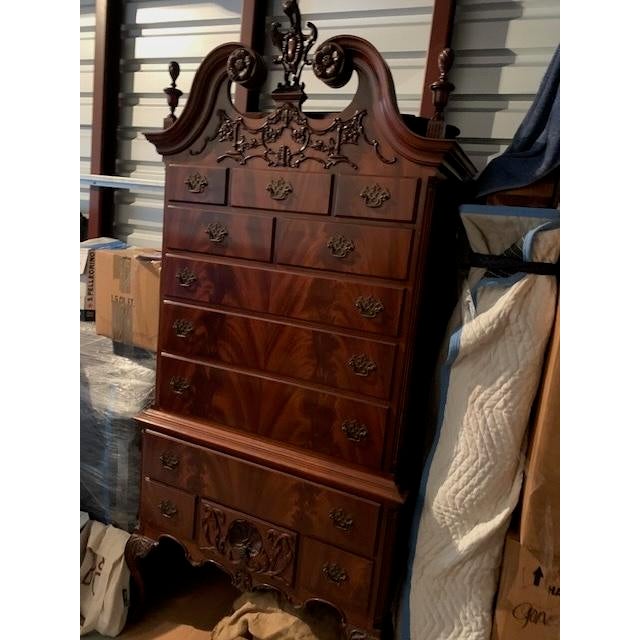 Exquisite 1940's reproduction of Philadelphia mahogany highboy. It has 12 drawers. Cherry finish piece measures 82" x 34"...