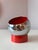 This ashtray consists of two parts: the red magnetic base and the spherical chrome bowl with a red interior. The magnet...