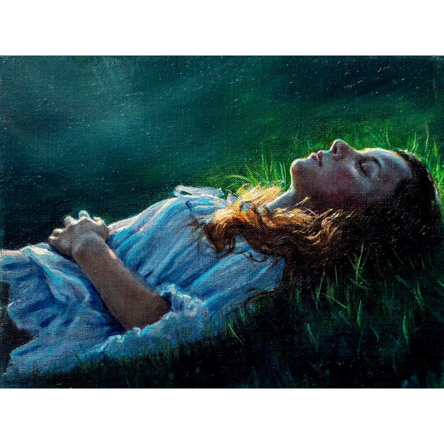 In a Dream by Sarah Warda | Oil on panel Painting of a woman lying on grass with closed eyes. For Sale