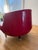 Rescued from a Miami hotel lobby, this swivel chair was recovered in red faux leather a few years back. 34” w x 25” d x...