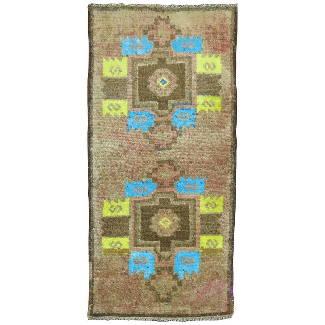 Electric blue and yellow-green cotton-colored accents highlight this fascinating vintage Turkish rug we have in our...