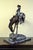 Outlaw, a cast bronze sculpture after American artist Frederic Remington's 1906 original, on marble base. Filled with a...