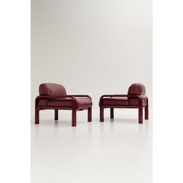 Model 54 armchairs designed by Gae Aulenti and produced by Knoll International. All-black models with a metal frame and...