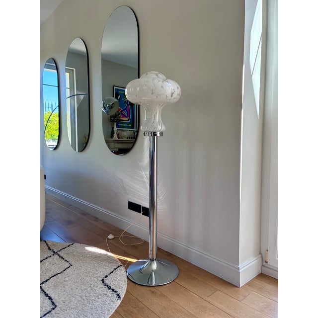 Chrome-plated metal floor lamp with a Murano blown glass shade. Signed Carlo Nason for Mazzega. 1970s. Circular base. In...