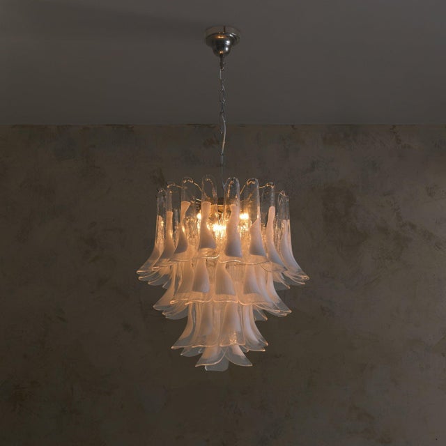 A contemporary Italian glass chandelier in the manner of Mazzega, composed of 40 handblown Murano glass elements. Each...