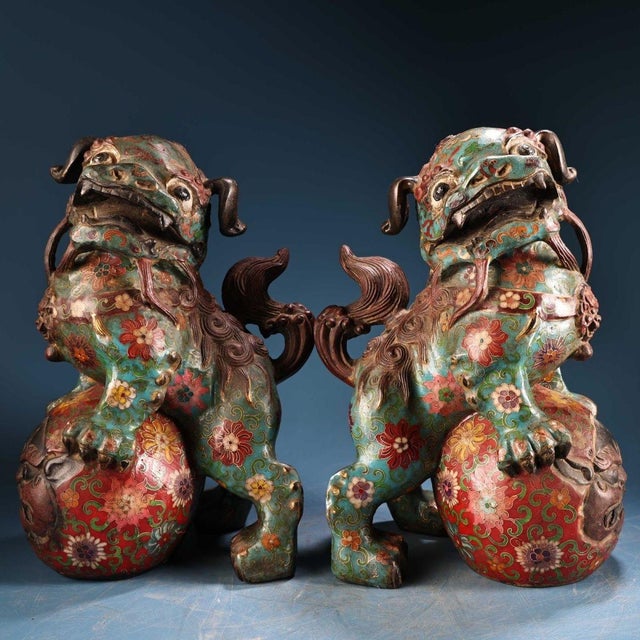This is a matching pair of cloisonné enamel figurines in the form of guardian lions (Foo Dogs), likely designed as joss...