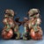 This is a matching pair of cloisonné enamel figurines in the form of guardian lions (Foo Dogs), likely designed as joss...