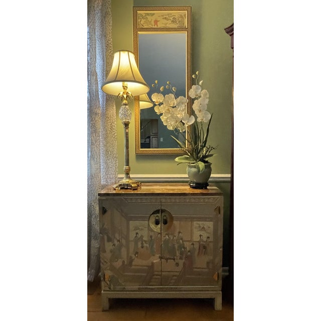 Presenting a stunning, factory-matched 2-piece vintage Chinoiserie credenza and trumeau pier mirror set from the highly...