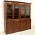 8-door bookcase Late 19th century Dimensions: width 243 cm, depth 47 cm, height 231 cm Restored (see photo)