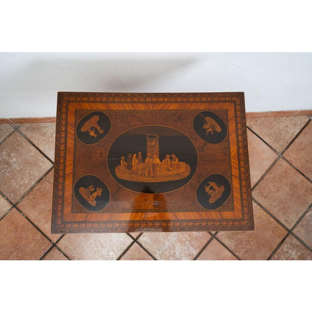 Description: Sorrento coffee table made of fine exotic woods, dating from the first half of the 19th century. At the...