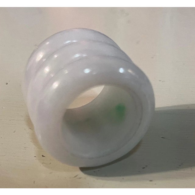 Chinese carved jade archer's ring. Measures 1 1/4" diameter x 1" tall. Dates from the early 20th century. Good condition.