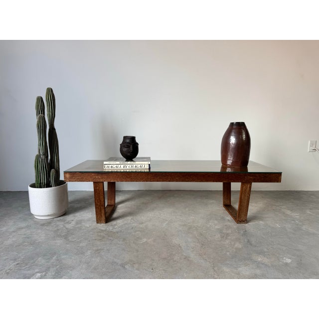 A striking 1970s Mid-Century Modern slatted bench or coffee table in the style of George Nelson. This piece features a...